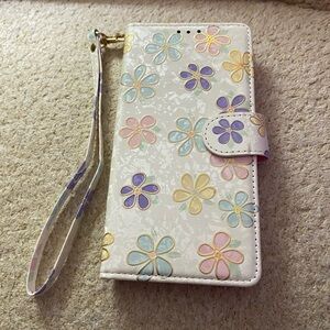 IPhone 11 phone case with carry strap and holds 2 credit cards and ID card.